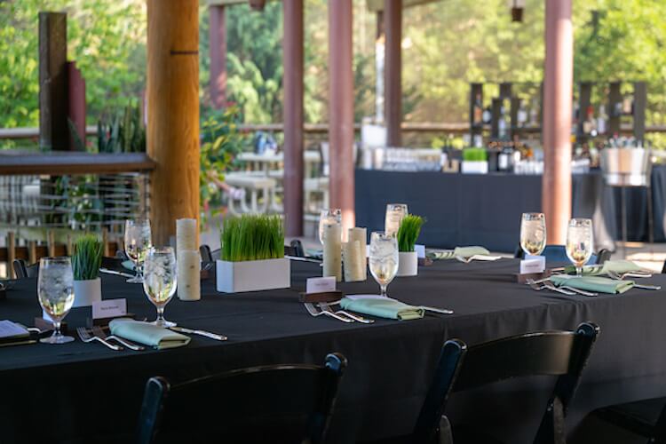 Place setting at a table with black cloth