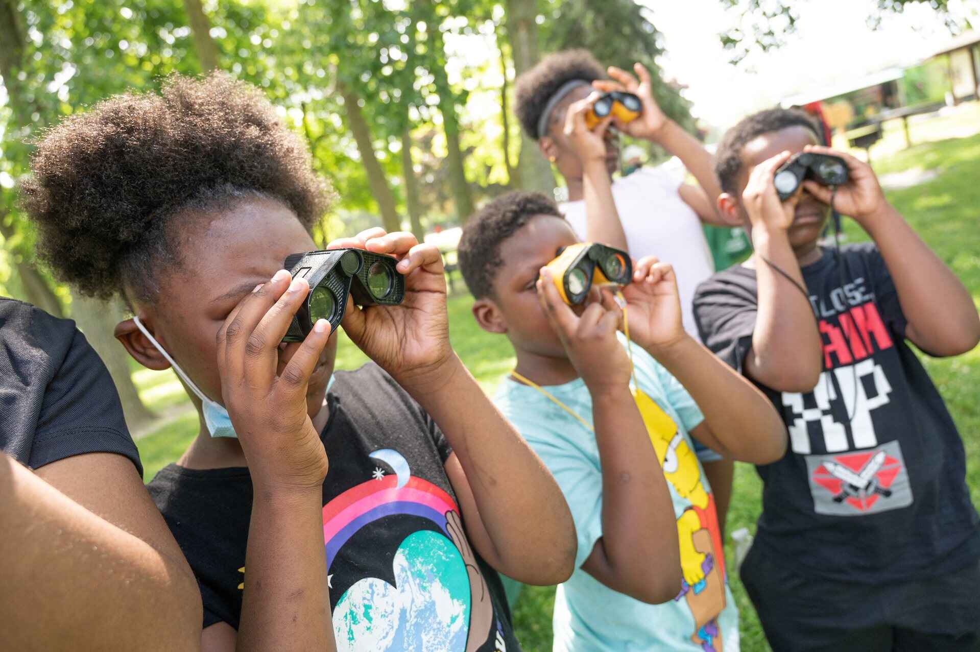 Kids looking through binoculars