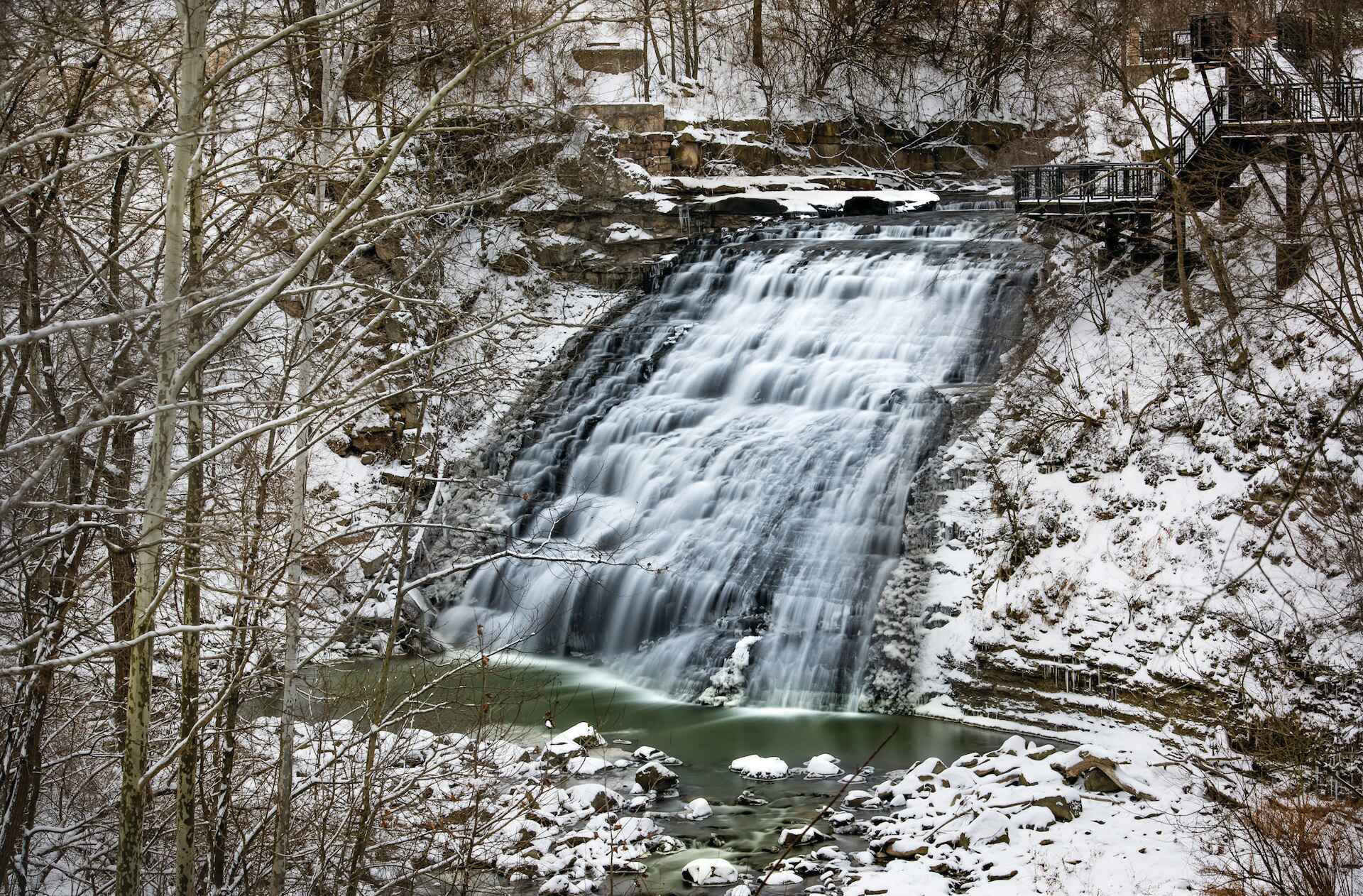 Waterfall in the middle of a winter forest 