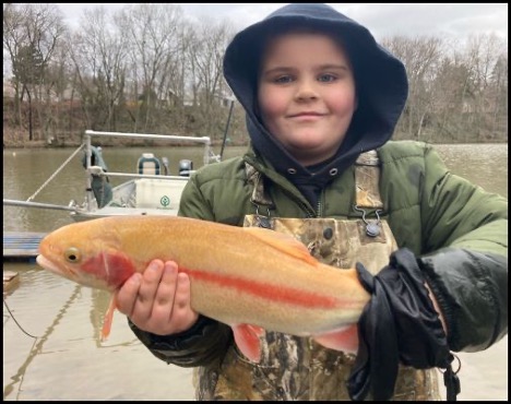 Boy holding a fish