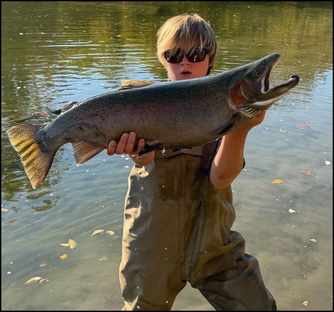 Boy holding a fish