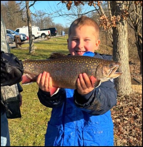 A child holding a fish