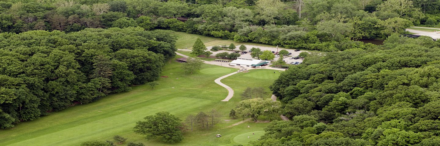 A bird's eye view of a building on a golf course