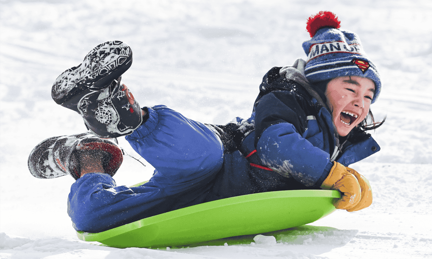 Person sledding on snow