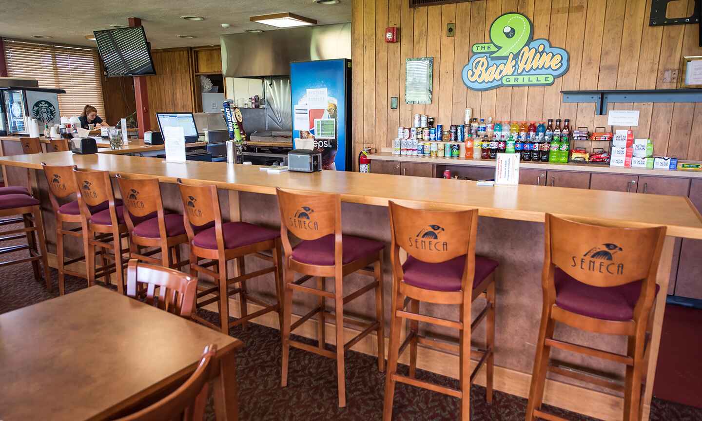 Restaurant bar counter with stools