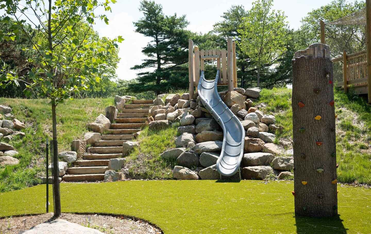 Play area with slide and rock climbing wall