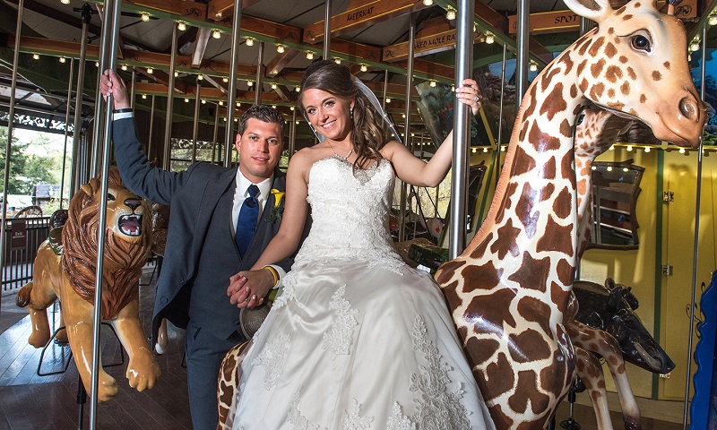 Bride and groom on a carousel 