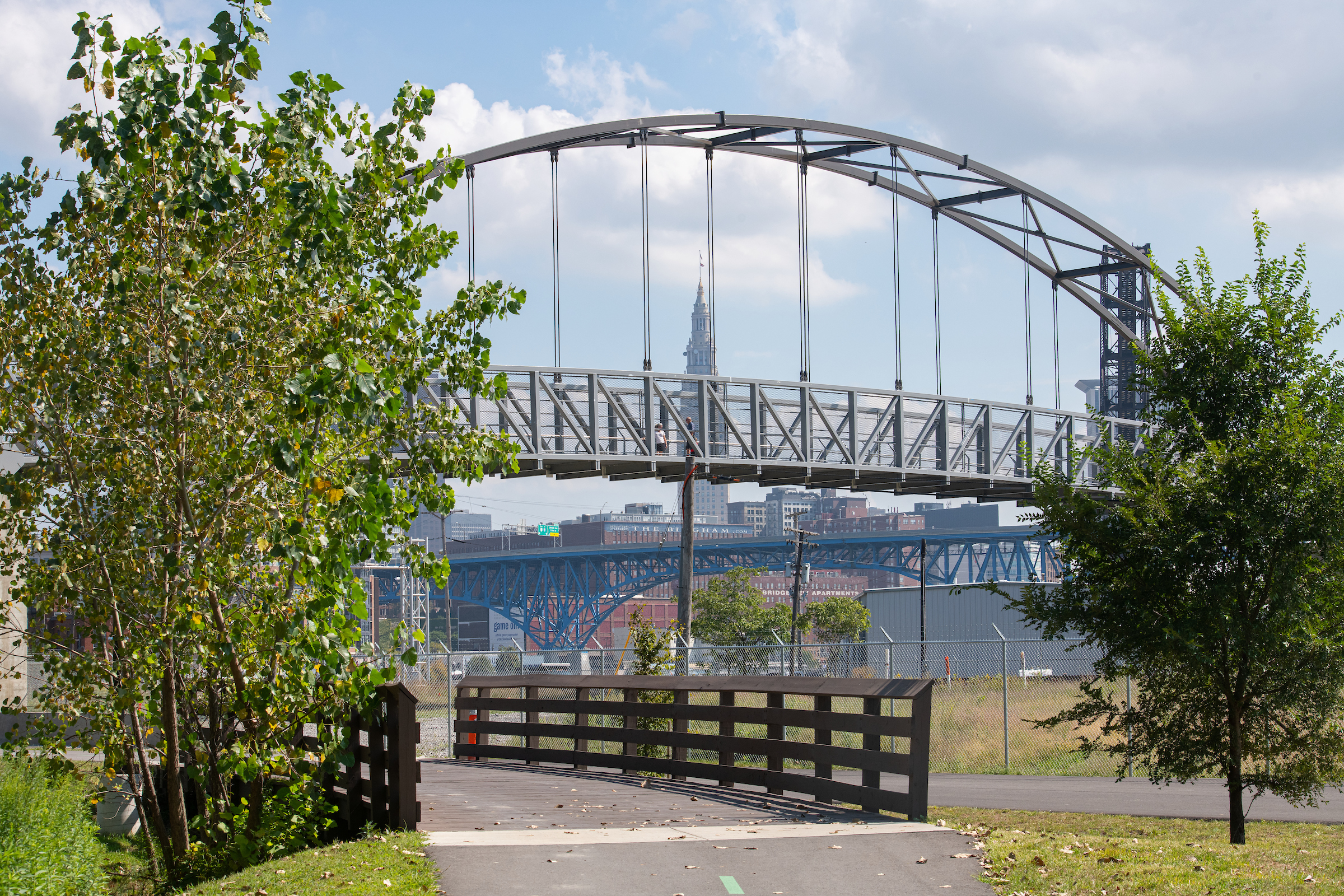 A bridge spans over a road, connecting two sides and providing a pathway for vehicles and pedestrians.