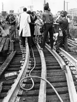 Carl-Stokes-Press-Conference-on-1969-Fire-with-Reporters.jpg